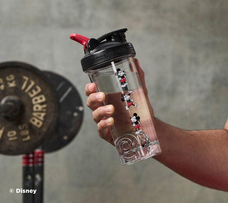 pro-series-b9 Mickey_Mouse_Protein_Shaker_Bottle_Being_Held_In_the_Gym.jpg